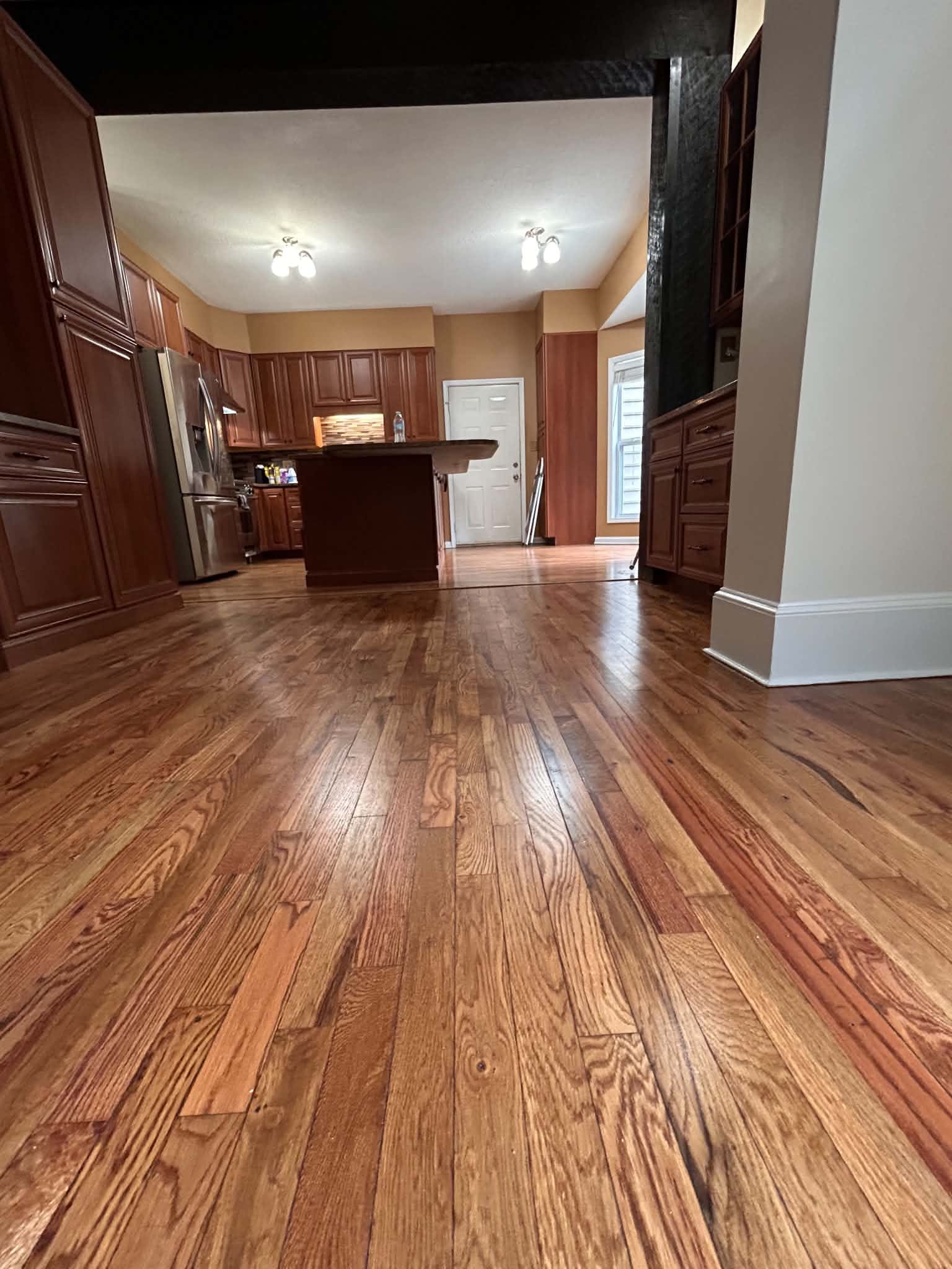 Kitchen flooring beside wood cabinets